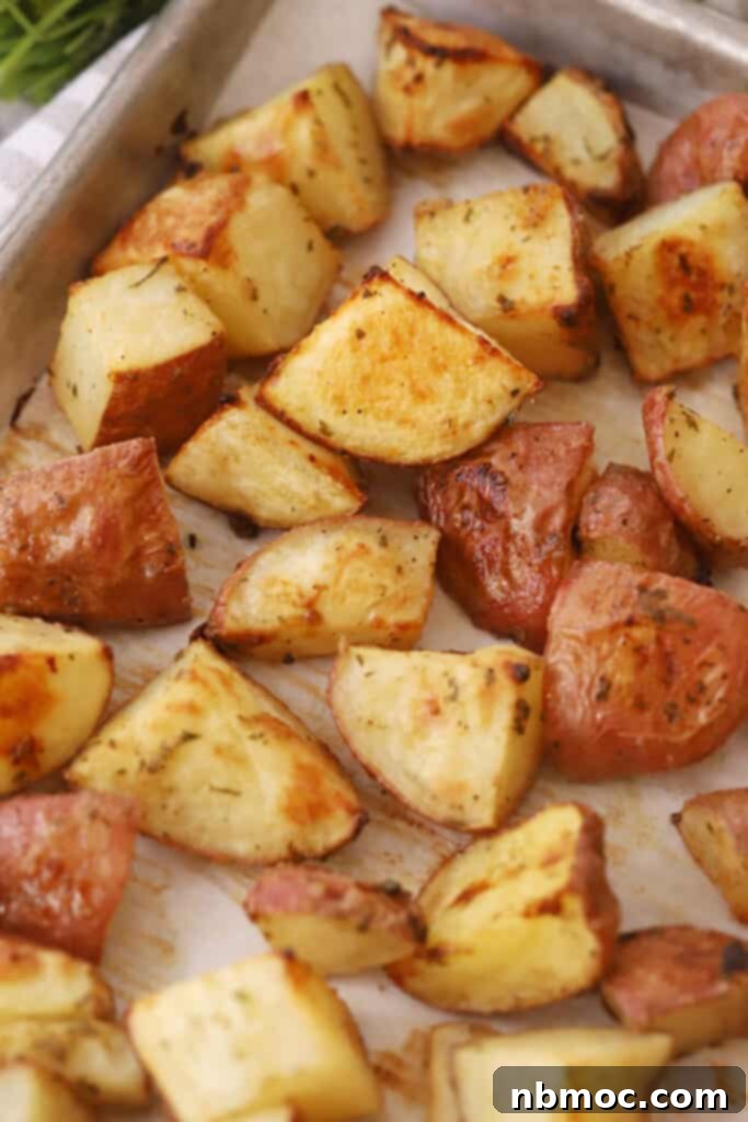 Ranch Roasted Potatoes on a baking sheet, golden and crispy, fresh out of the oven.