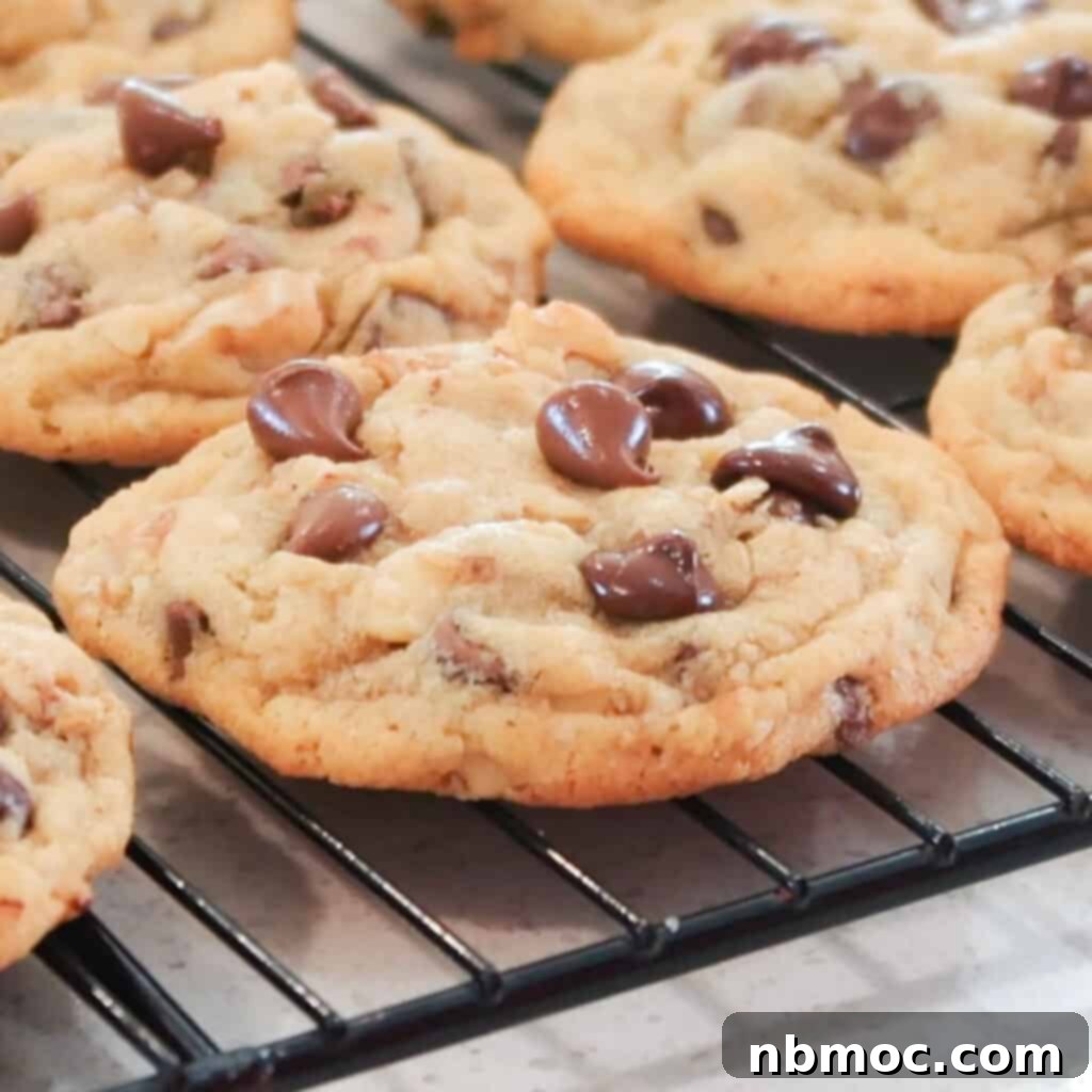 DoubleTree Chocolate Chip Cookies cooling on a wire rack, a unique and delicious holiday cookie recipe.