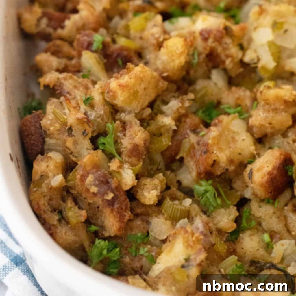A close-up shot of Grandma's Thanksgiving stuffing, golden brown and perfectly baked in a dish, ready to be served as one of the best Thanksgiving side dishes.