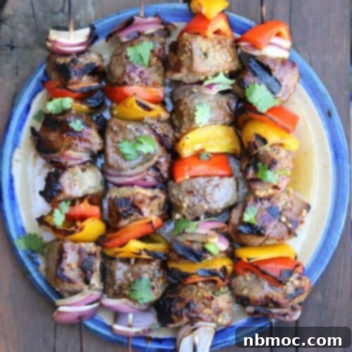 beef shish kabobs cooked and on a plate