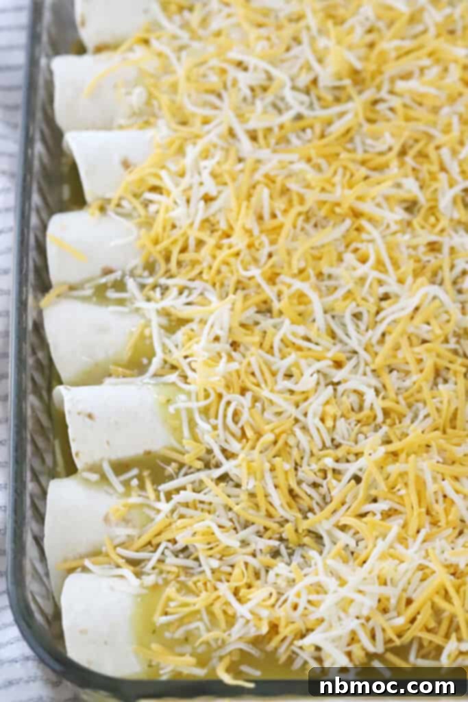 Ultimate Green Chile Chicken Enchiladas 4 Chicken cream cheese enchiladas topped with sauce and cheese, ready to bake.