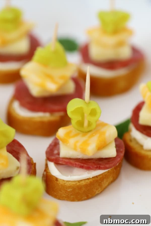 Zesty Italian Kebab Bites 2 A platter full of mini italian kebabs made with salami, cheese, and pepperoncini, ready to be served.