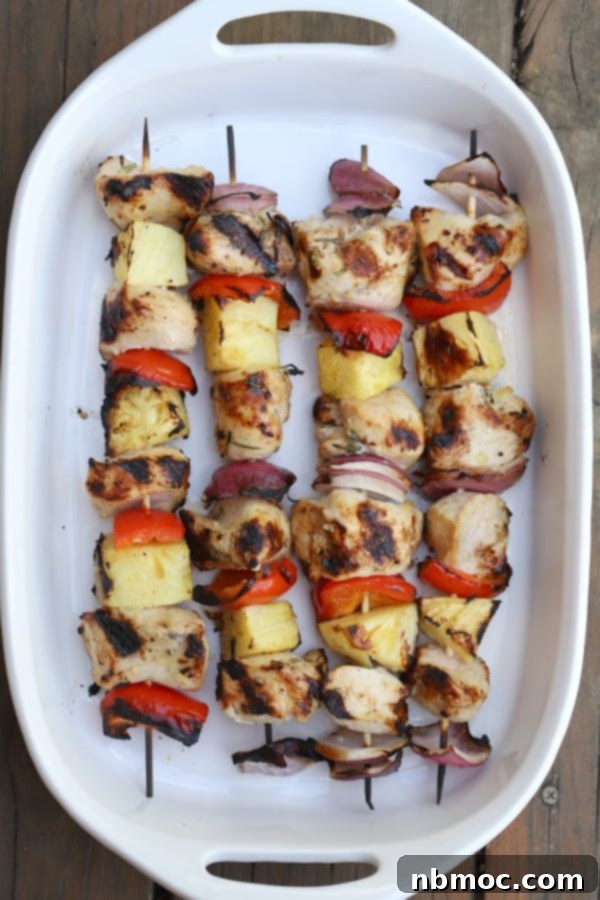 Grilled chicken kabobs with a rosemary and lemon chicken marinade, an easy chicken skewers appetizer.