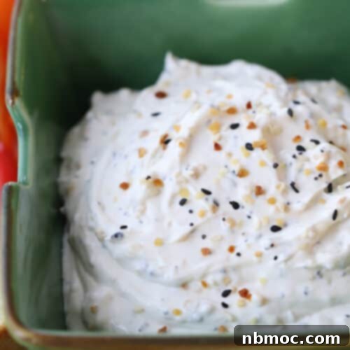 Everything Bagel Dip in a bowl with dippers