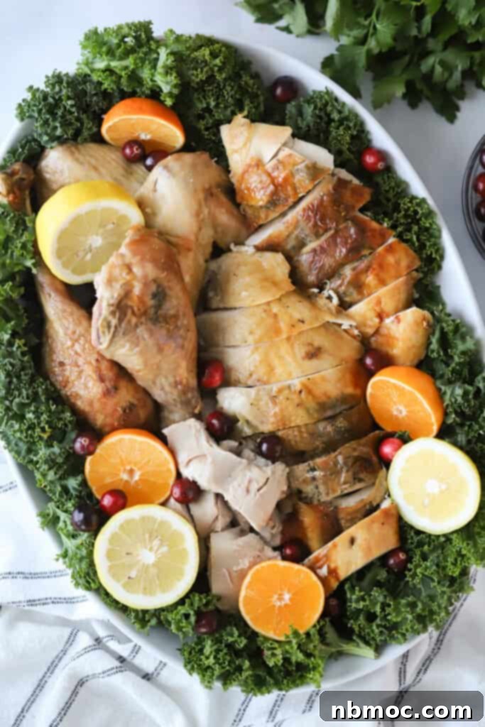 A whole oven roasted turkey on a serving platter.