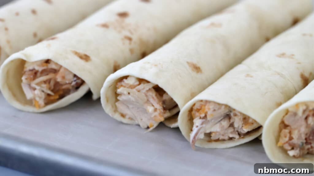 Golden Crisp BBQ Chicken Taquitos 4 Hand-rolling homemade BBQ chicken taquitos with cream cheese and shredded chicken filling.