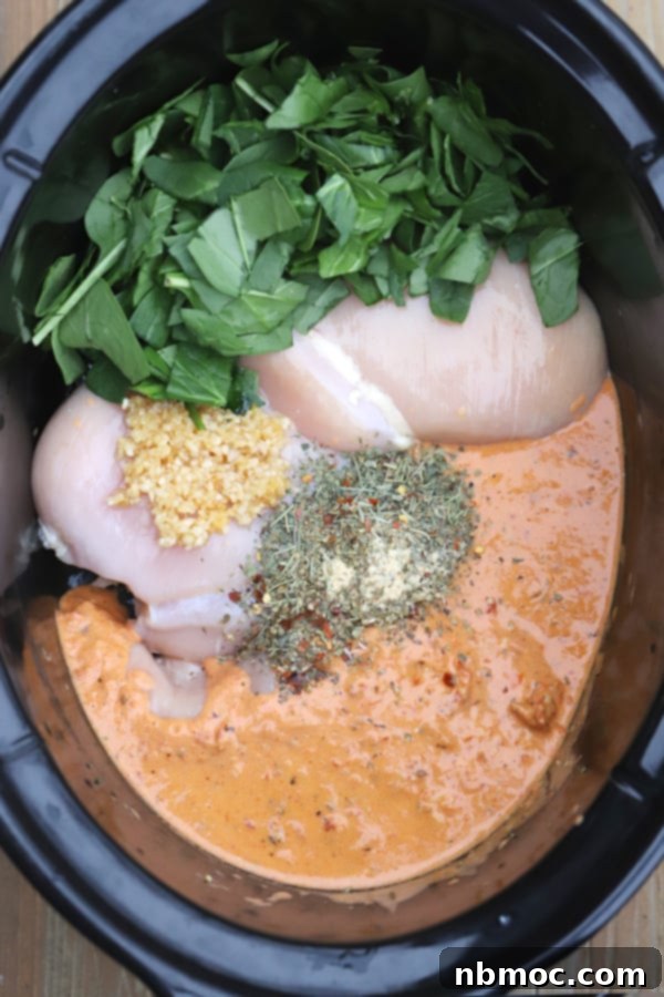 Effortless Creamy Tuscan Slow Cooker Chicken 2 easy slow cooker tuscan chicken ingredients in a crockpot