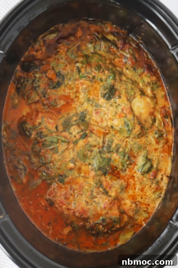 Effortless Creamy Tuscan Slow Cooker Chicken 6 creamy chicken slow cooker , tuscan chicken in slow cooker cooking in creamy sundried tomato sauce with spinach.