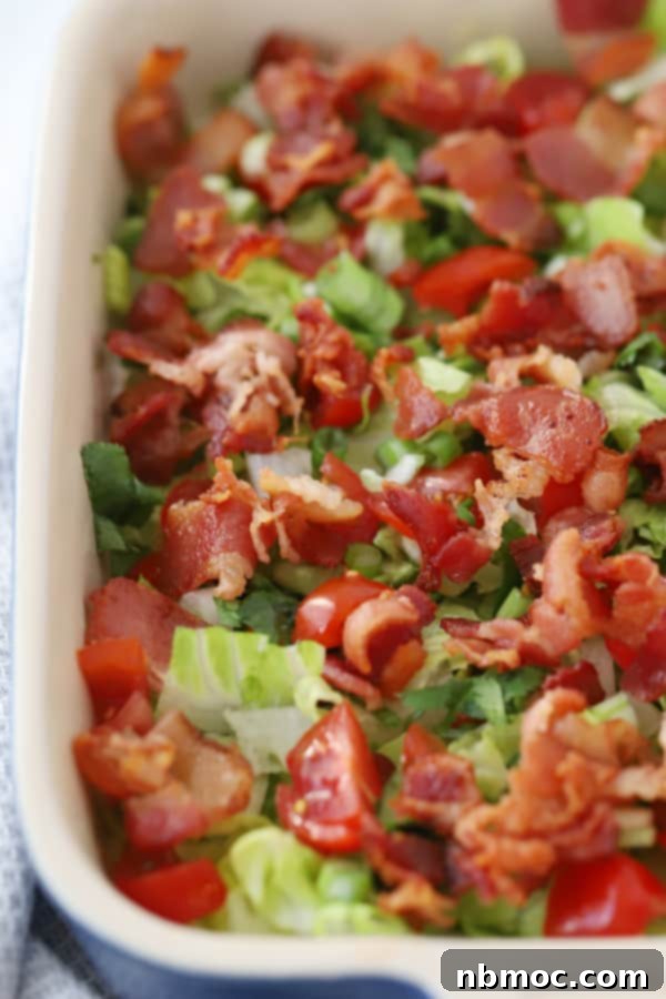 BLT dip in a glass baking dish.