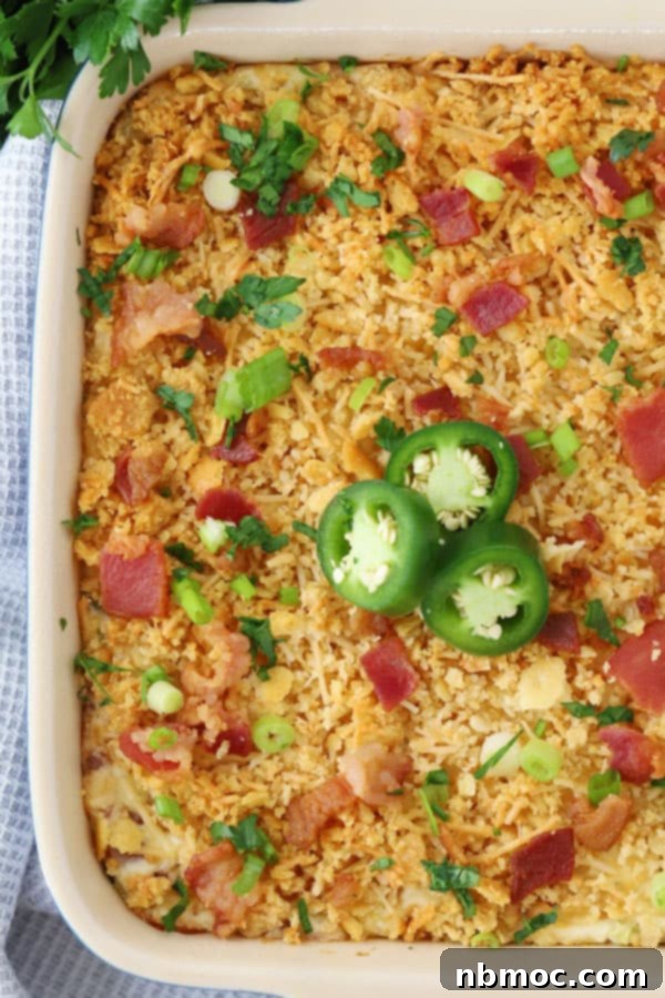 Jalapeno popper dip in a white serving dish.