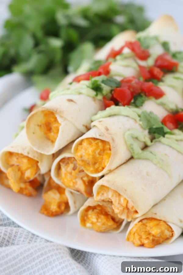 Buffalo chicken taquitos on a plate.