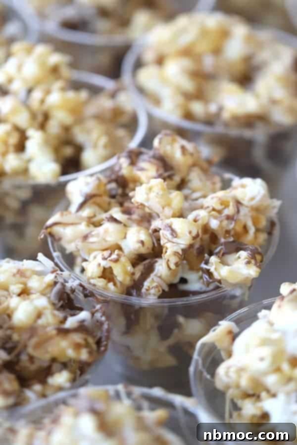 Coconut caramel popcorn in small party cups.