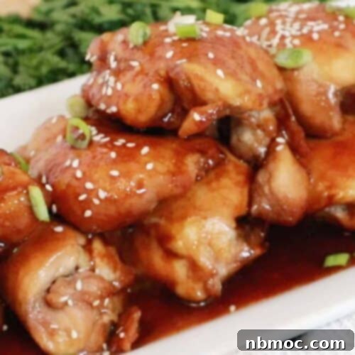 Honey Soy Chicken Thighs on a white platter, baked honey soy chicken thighs.
