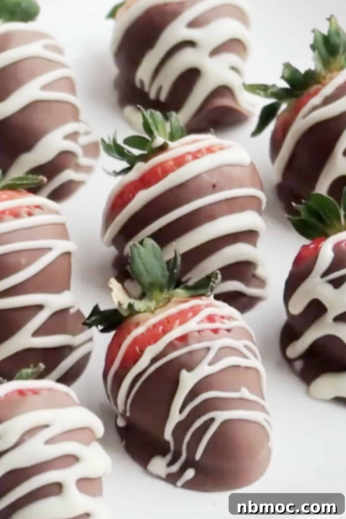 Velvet Berries, Chocolate Embrace 4 homemade chocolate-covered strawberries, chocolate dipped strawberries with a white chocolate drizzle, how to dip strawberries in chocolate. toppings for chocolate covered strawberries. white chocolate dipped strawberries. chocolate covered strawberries recipe.