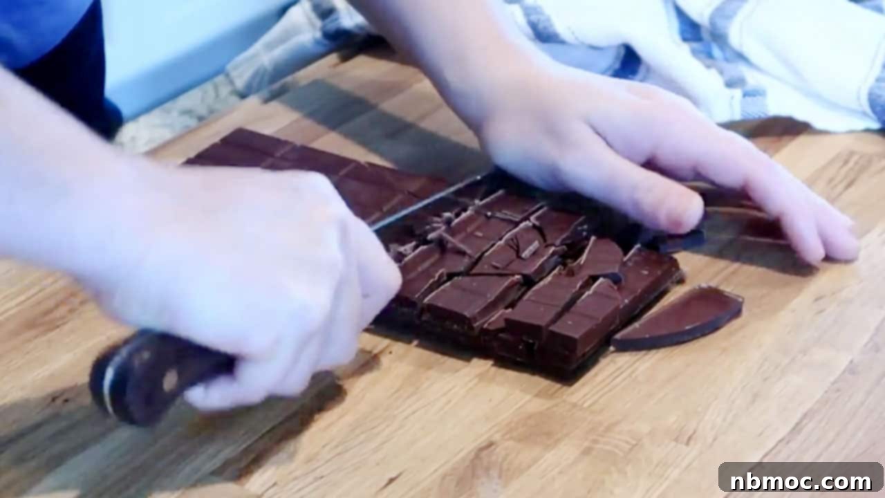 Chocolate Bliss Melt 3 Chopping chocolate bar for chocolate fondue, fondue recipe chocolate, chocolate for fondue, milk chocolate fondue recipe, chocolate fondue recipes, best fondue chocolate.