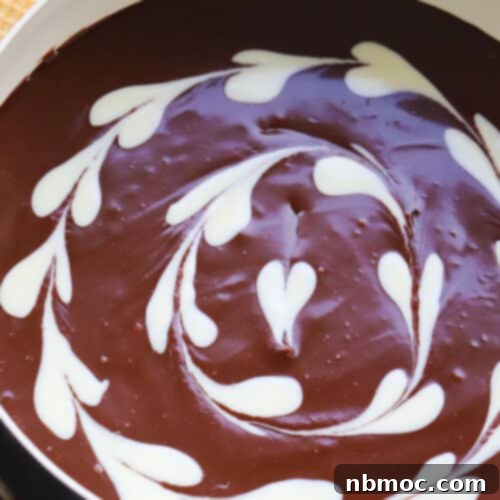 Chocolate Bliss Melt 9 Close-up of a bowl of chocolate fondue surrounded by dippers.