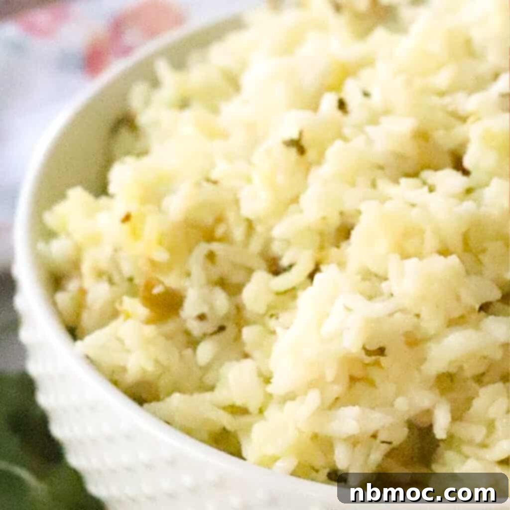 chipotle cilantro lime rice in a white serving bowl, an easy chipotle rice copycat recipe.