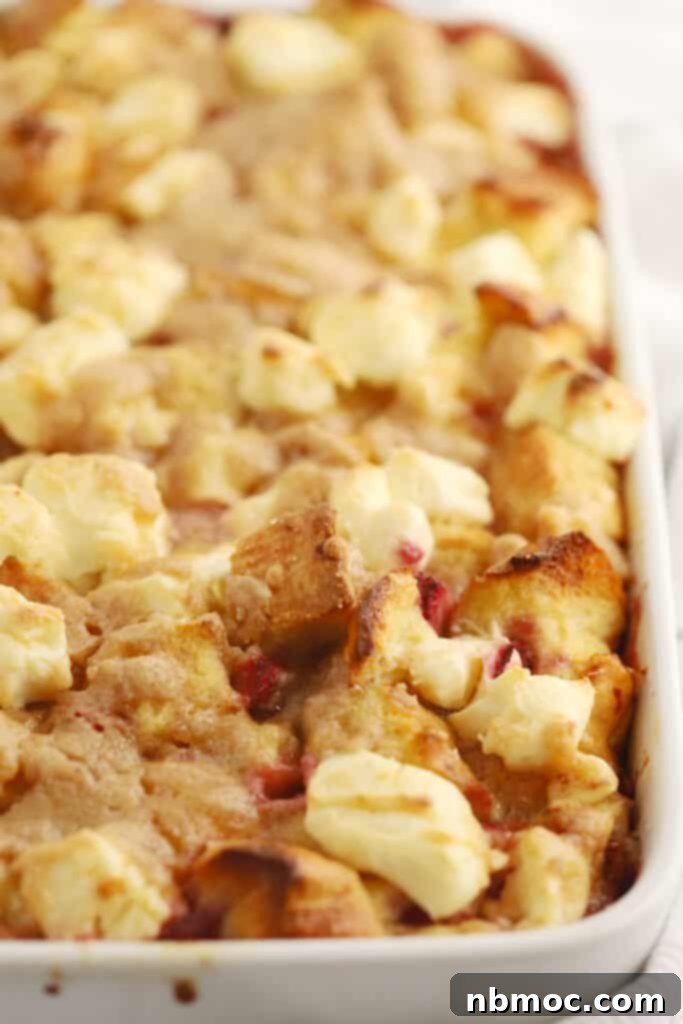 Delicious strawberry cream cheese French toast bake recipe in a white baking dish, perfect for an overnight breakfast casserole.