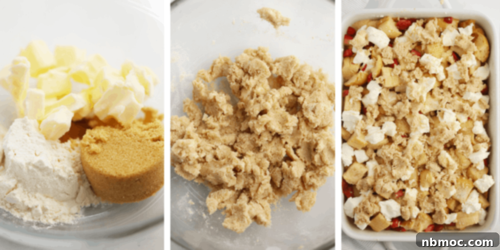 Close-up view of the streusel topping for a French toast bake, with cream cheese and strawberries visible beneath.