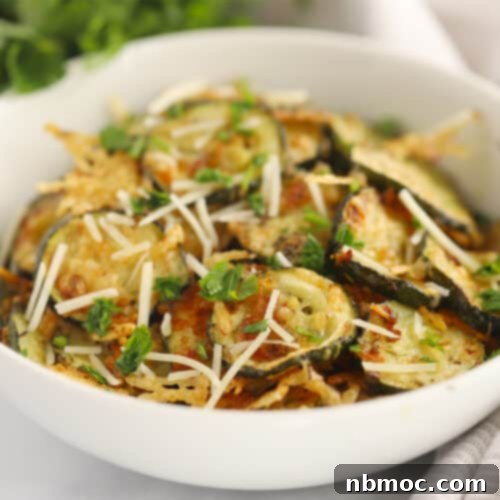 Oven-roasted zucchini with golden Parmesan cheese, a perfect easy side dish.