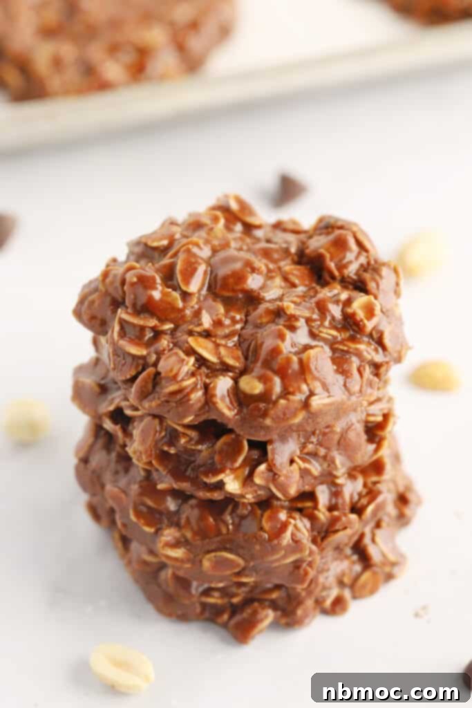 A beautifully arranged stack of chocolate peanut butter no bake cookies, showcasing their inviting texture and easy appeal.