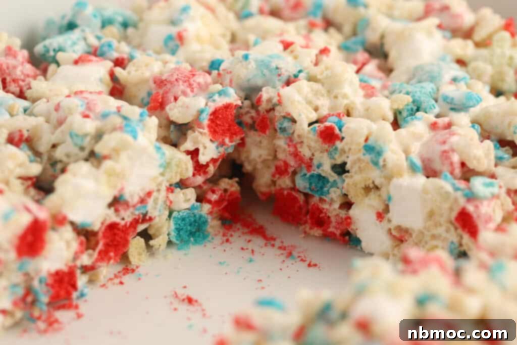 Stars & Stripes Cereal Bars 5 A pan of red white and blue rice krispies treats with a square missing.