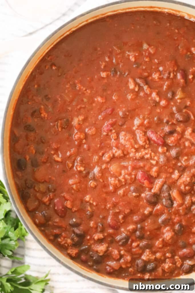 Ultimate Beef Chili 2 A big pot full of this rich and flavorful beef chili with beans and ground beef, ready to be served.