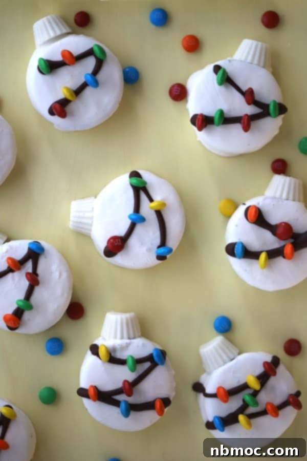Christmas Oreos, white chocolate oreo cookies, decorated oreo covered in white chocolate for holiday festivities, on a white tray.