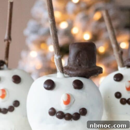 Caramel apples decorated as snowmen