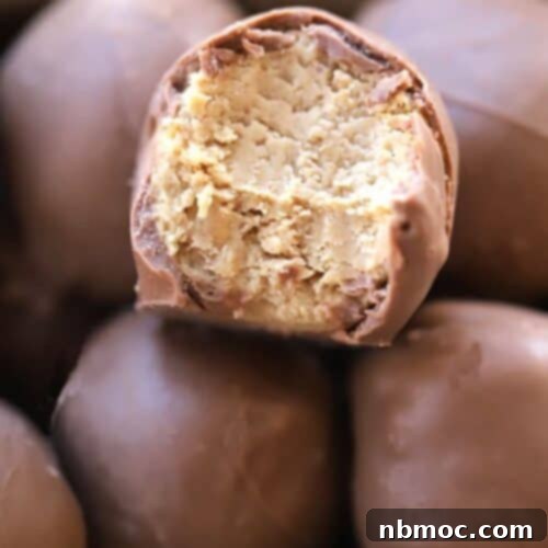 A festive Christmas gift box overflowing with beautifully arranged buckeye balls or peanut butter balls.