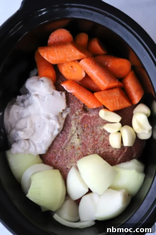 rump roast made in the slow cooker, served with a rich, savory gravy, showcasing a perfect crockpot rump roast recipe.