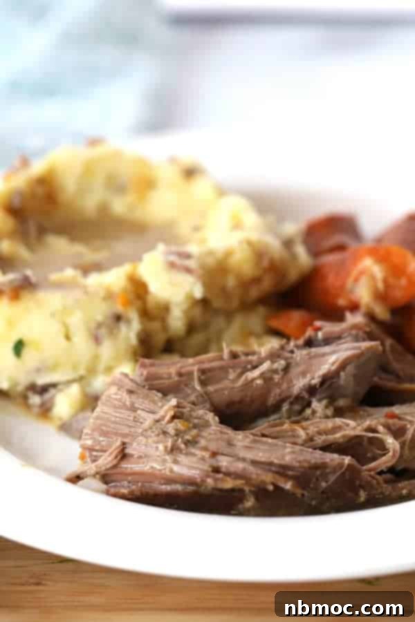 rump roast in slow cooker, served with creamy mashed potatoes and vibrant carrots, showcasing a complete and comforting rump roast recipe slow cooker meal.