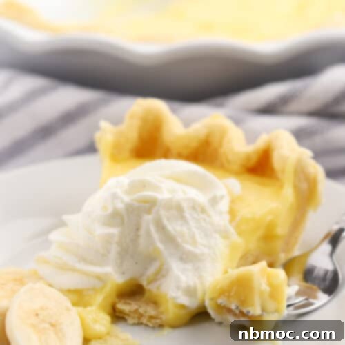 banana cream pie slice on a white plate