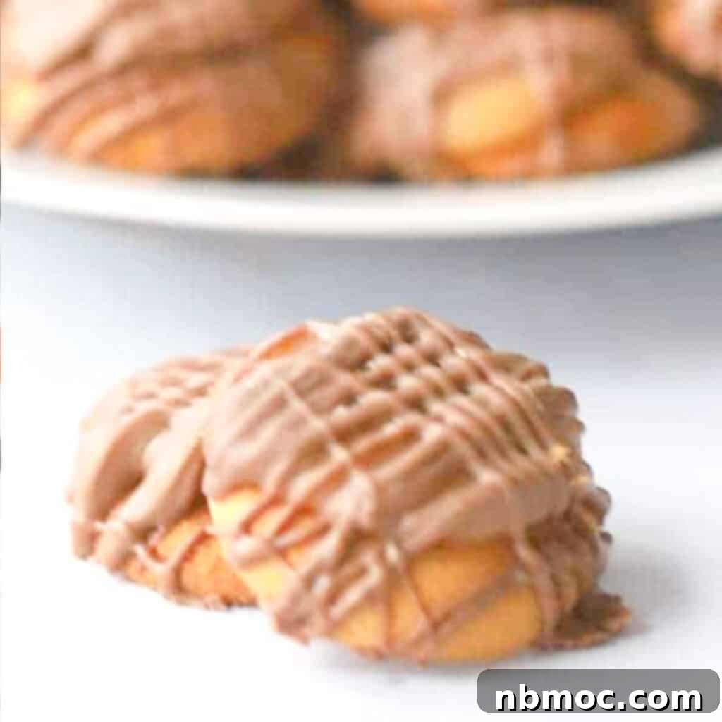 Easy Christmas Candy recipe featuring Nilla Wafer Caramel Candies with a homemade caramel dollop and sweet milk chocolate drizzle.