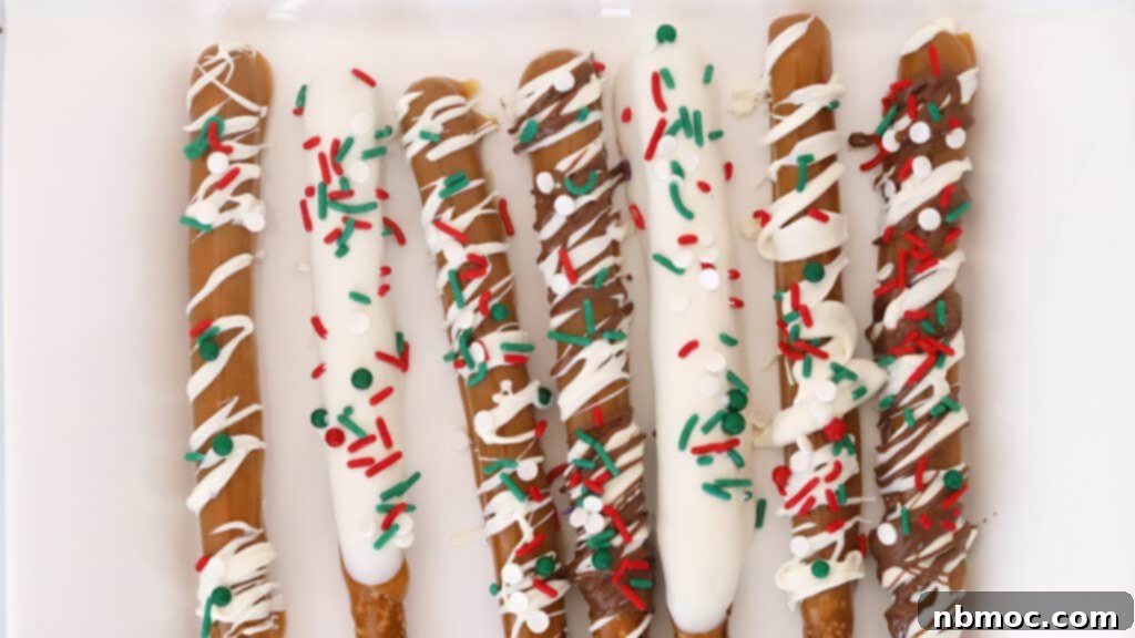 Festive Chocolate Covered Pretzels adorned with holiday-specific sprinkles, perfect for Christmas.