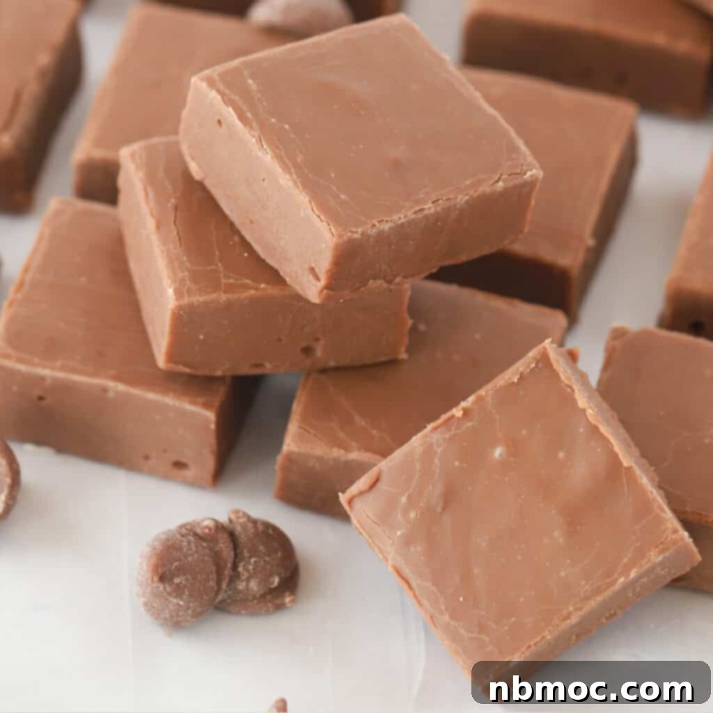 A perfectly square slice of easy chocolate fudge, showcasing its rich and smooth texture.