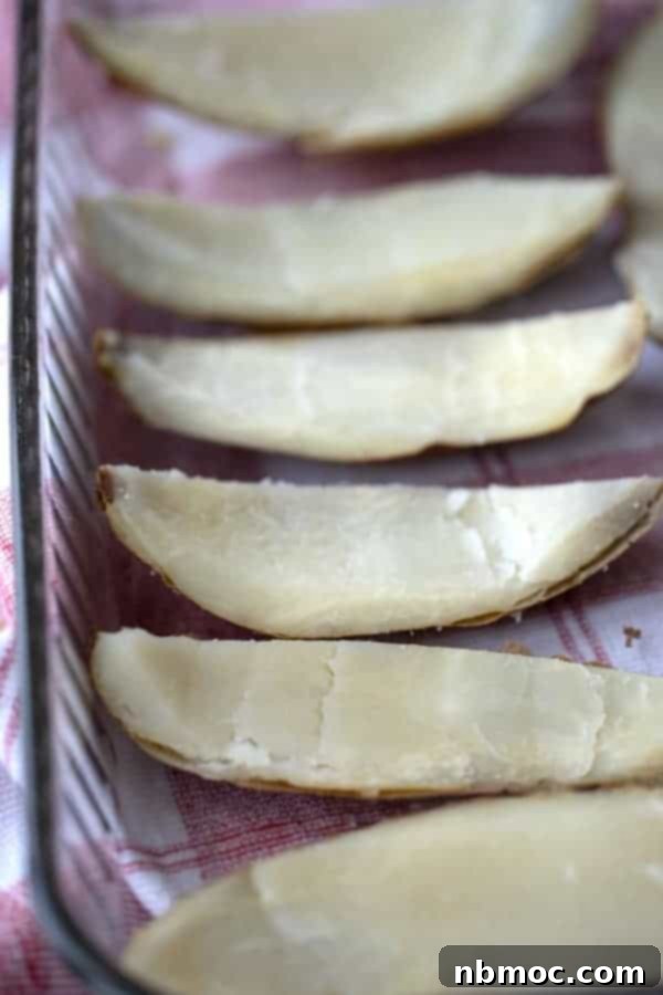 How to make potato skins in a baking dish with the flesh scooped out, ready to be filled for best potato skin recipes. 