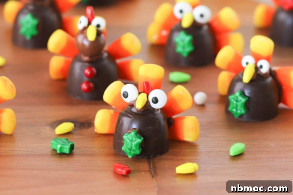 Chocolate turkeys for thanksgiving made with candy corns, chocolate candies and other decorations on a table.