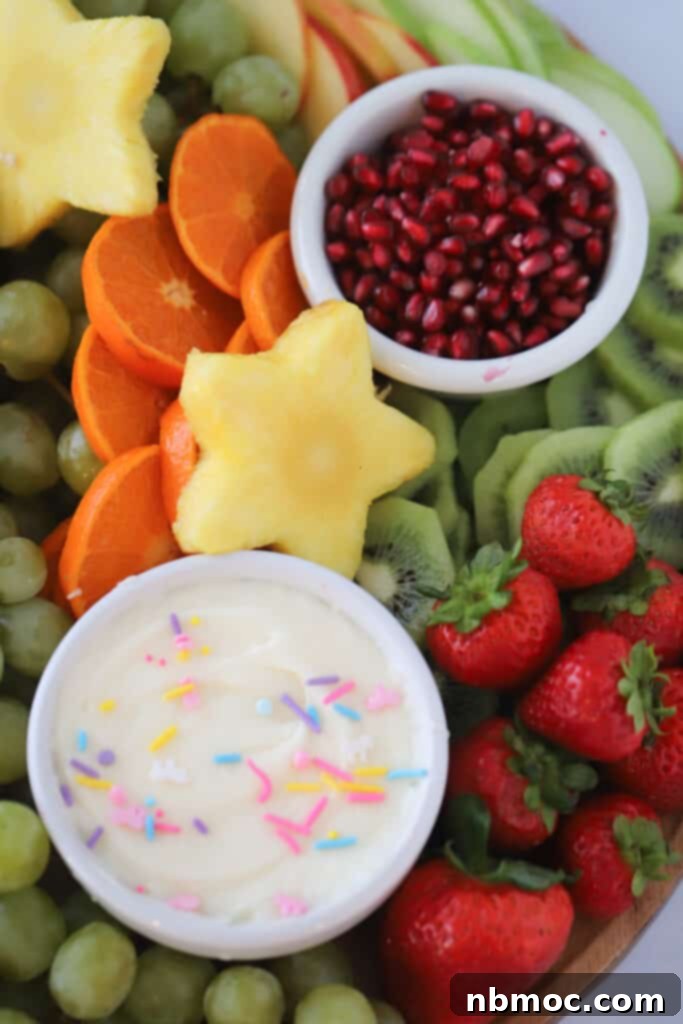 fruit charcuterie board with dip for fruit.
