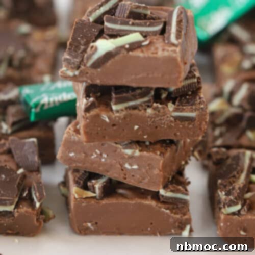 Andes mint fudge stacked in a pile with mints around