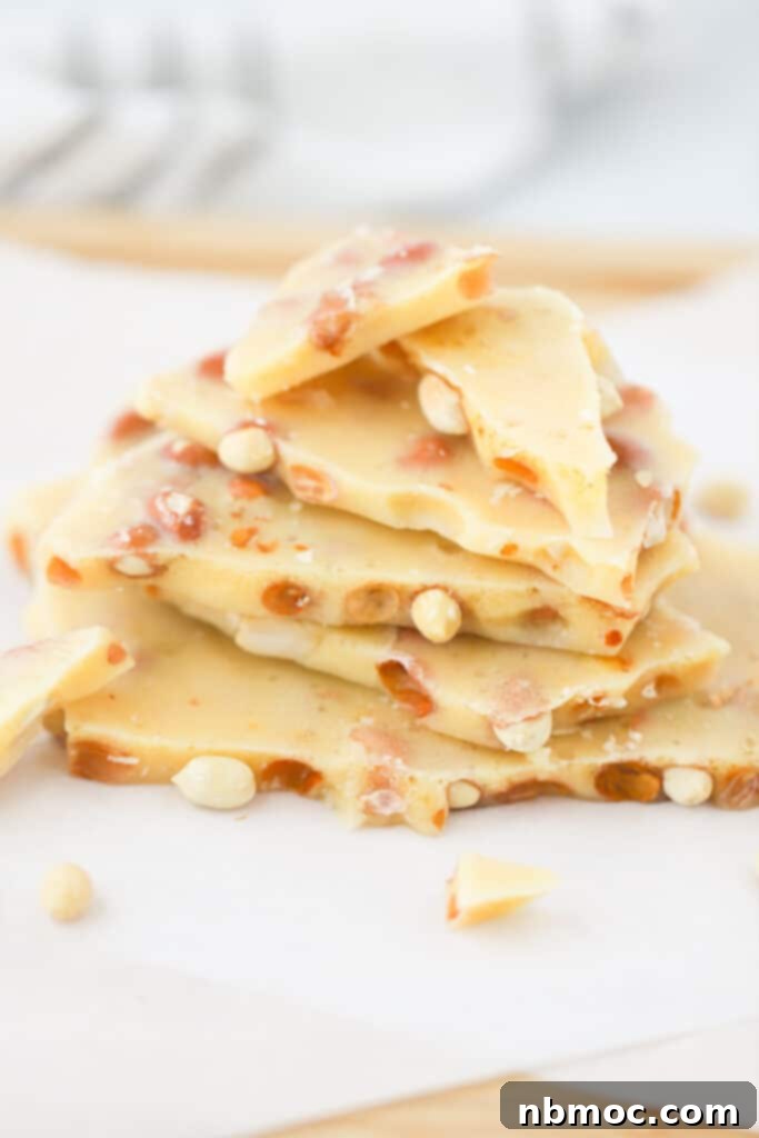 old-fashioned peanut brittle recipe, stacked on top of each other on a baking sheet.