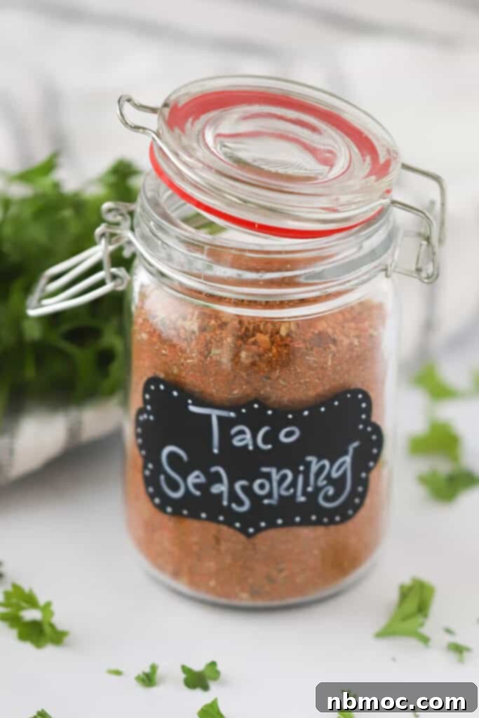 A mason jar full of Homemade Taco Seasoning mix. 