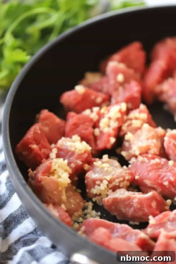 How to cook steak cubes in a saute pan with garlic.