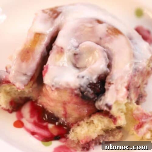triple berry sweet roll with lemon icing