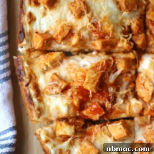 Effortless French Bread Pizza 7 buffalo chicken french bread pizza on a cutting board