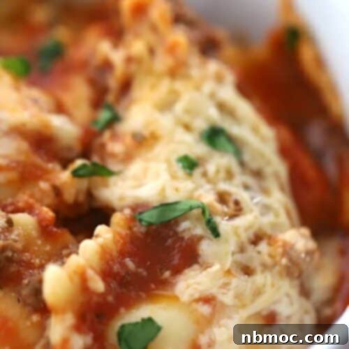 Effortless Slow Cooker Ravioli Lasagna 6 crockpot lasagna with ravioli- in a large white bowl, ravioli lasagna crockpot recipe.