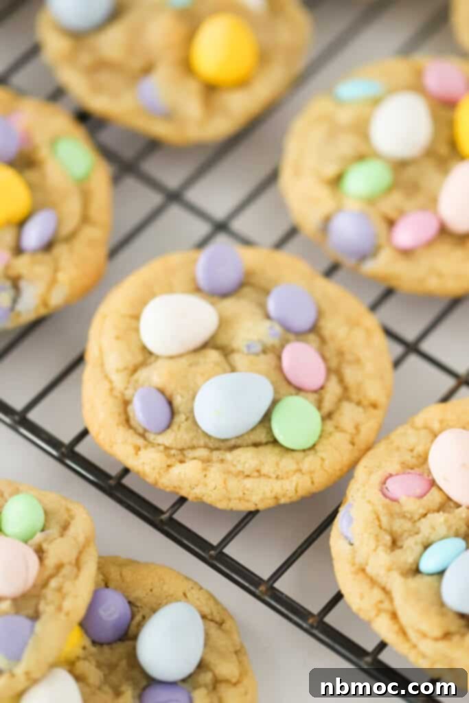 A cooling rack full of Cadbury chocolate chip cookies with mini eggs, AKA cadbury eggs cookies.