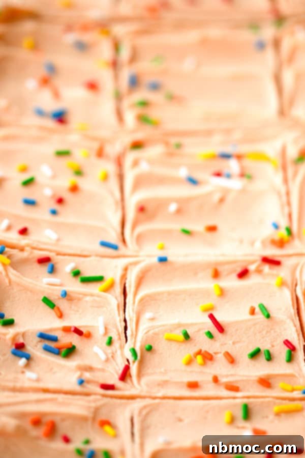 Sunshine Creamsicle Cookie Bars 2 Freshly baked orange creamsicle sugar cookie bars, beautifully cut into squares and ready to serve, showing the soft cookie base and creamy orange frosting.