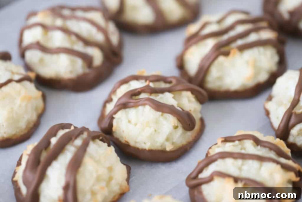 Coconut chocolate macaroon cookies on a sheet tray.