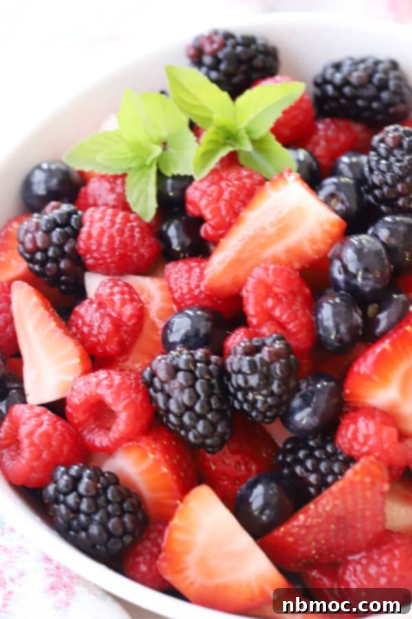 A vibrant berry salad with citrus glaze, fresh and colorful, perfect as a light side dish.